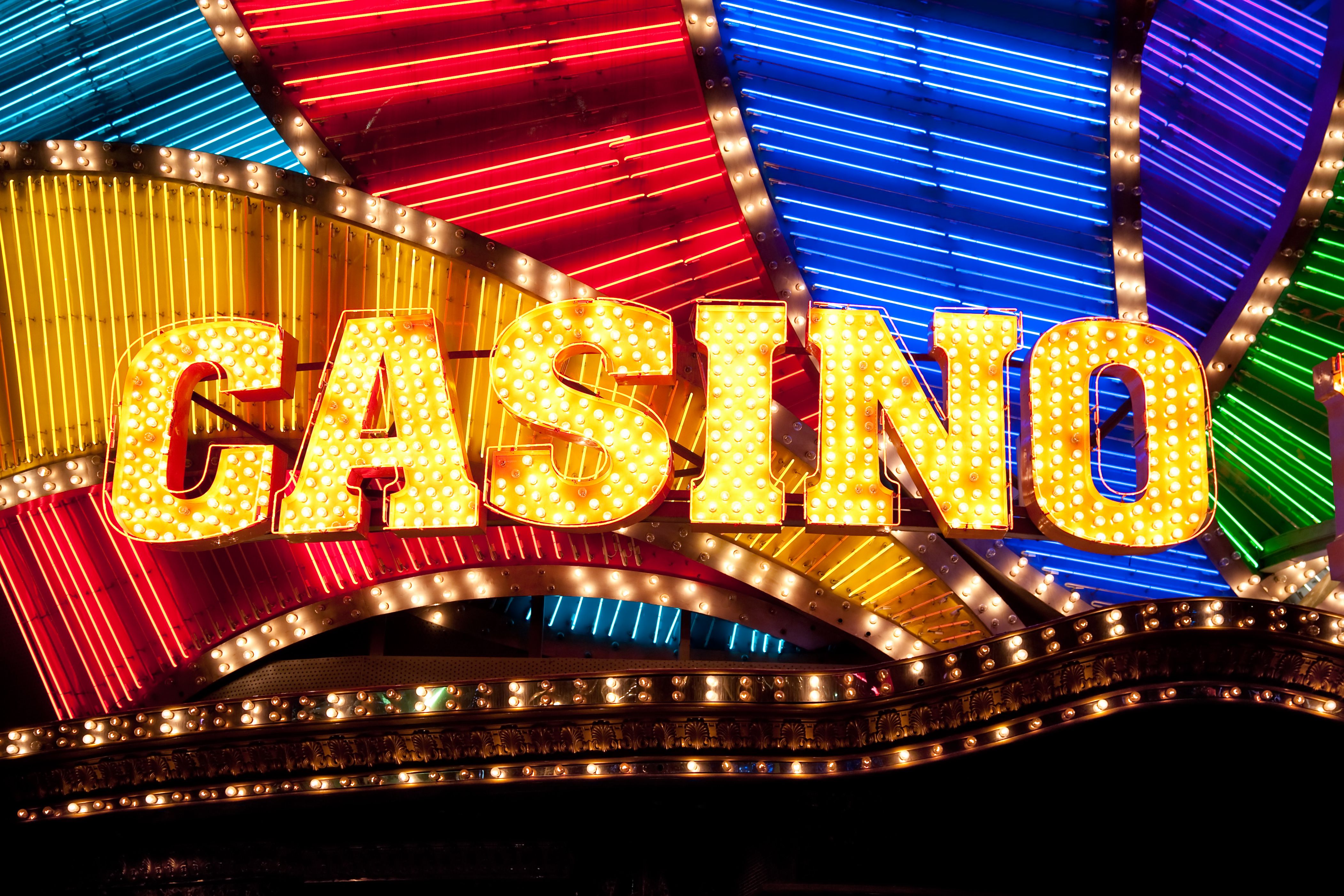A vibrant graphic showcasing the Lightning Link Casino logo with gold coins and lightning bolts.
